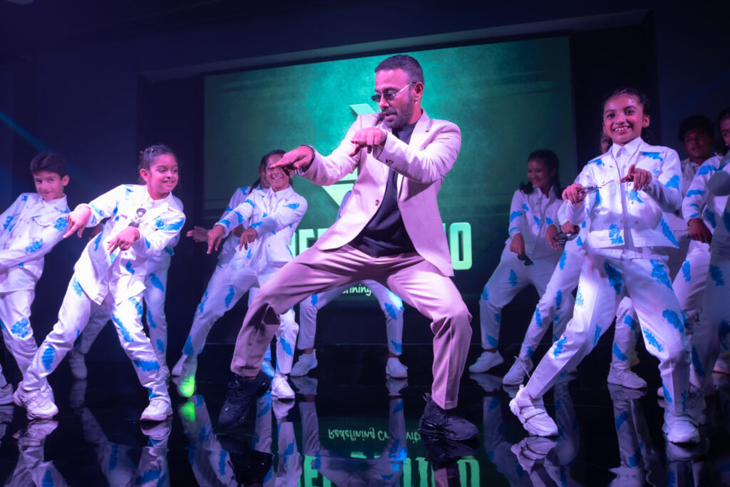 Dance instructor performing live on stage in front of an audience